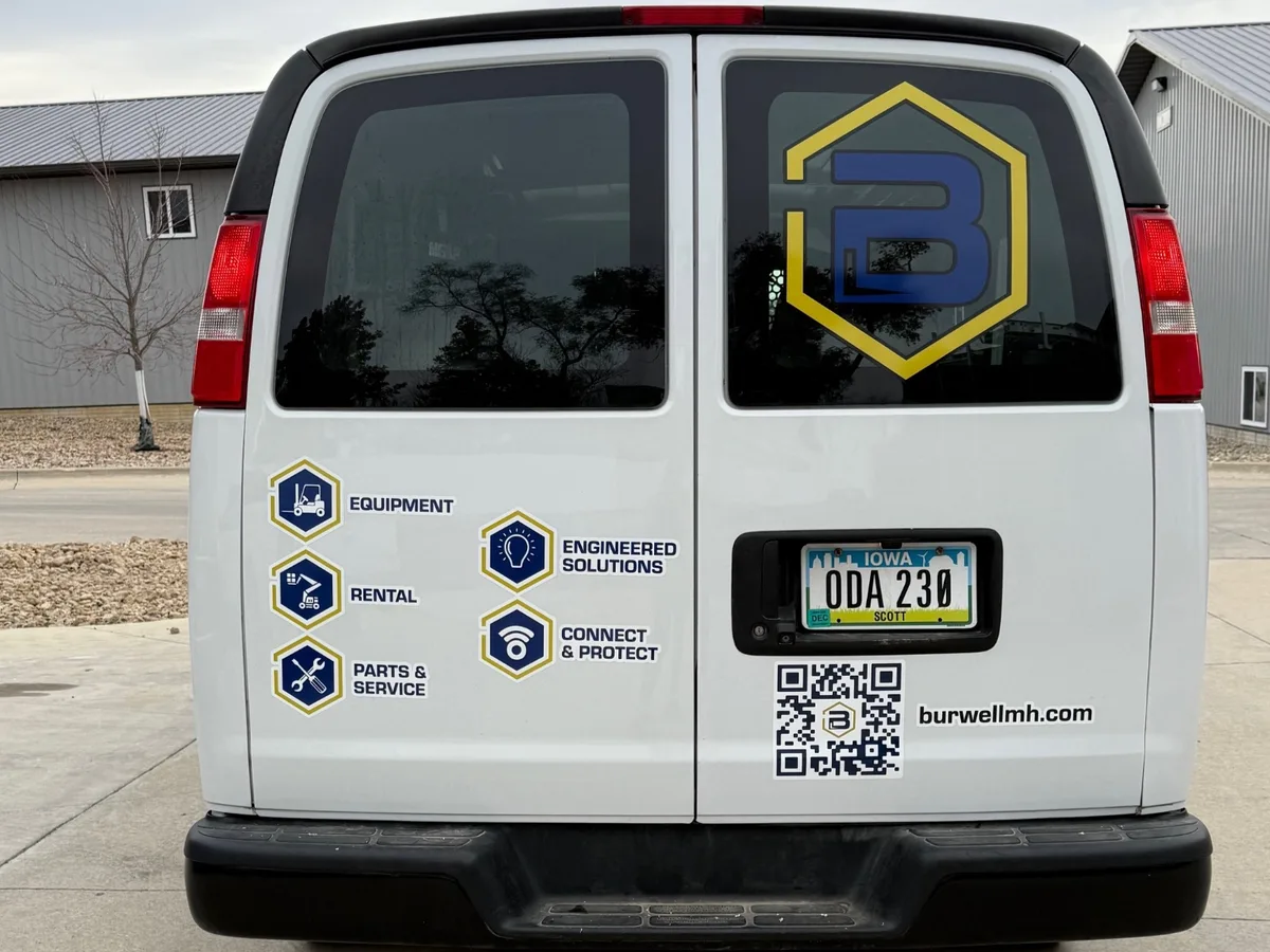 Spot graphics on a Chevrolet Express van in Waterloo, IA