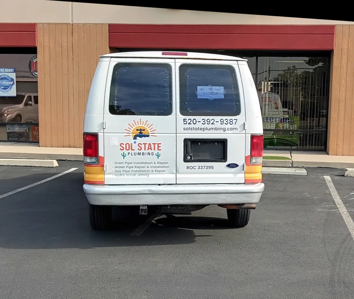 Spot graphics on a Ford E-Series van in Tucson, AZ